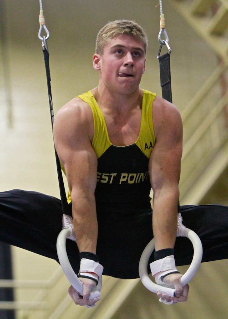 Kip Webber, Class of 2013, performs his rings routine during the 20thannual men's gymnastics  West Point Open Jan. 14, in Christl Arena. Seven colleges and more than six hundred athletes participated in the two-day event, featuring some of the best collegiate and youth gymnasts from the East Coast region. Friday was the team competition, from which those whoplaced in the top 8 qualified for Saturday individual finals. Photo by Tommy Gilligan/West Point Public Affairs